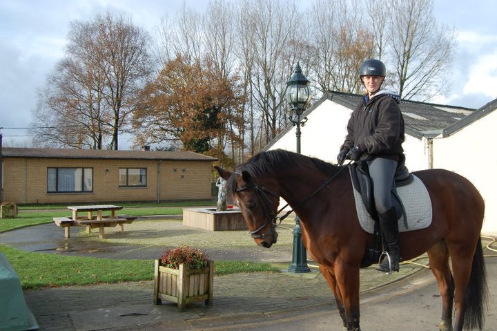 Krystal rides a horse in Belgium