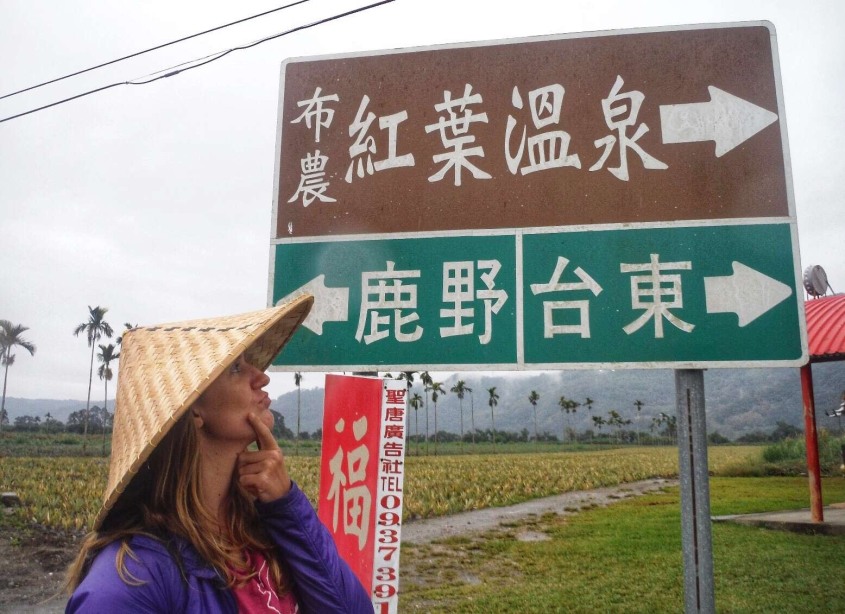 Krystal is wondering which way to go in Taiwan as she can't read the signs